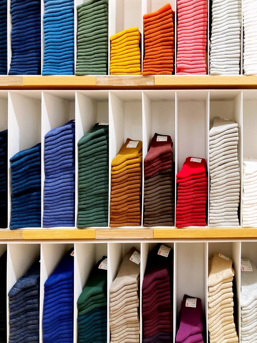 Neatly folded socks on boutique display shelves